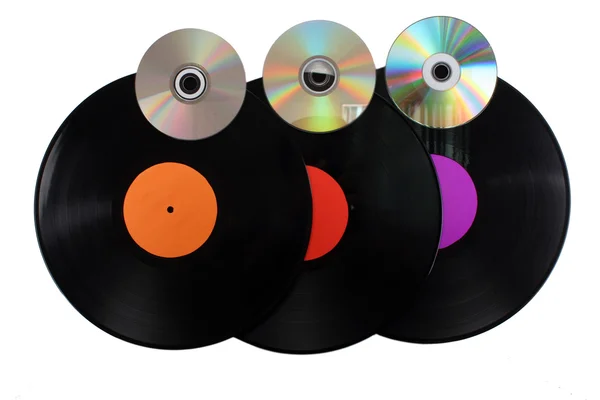 Black vinyl records and CD disks isolated on white — Stock Photo, Image
