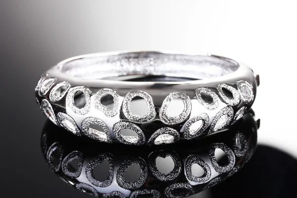 Beautiful silver bracelet on grey background — Stock Photo, Image