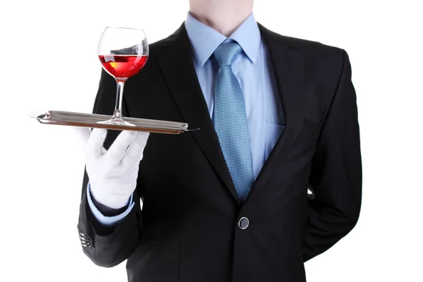 Garçom formal com um copo de vinho em bandeja de prata isolado em branco — Fotografia de Stock