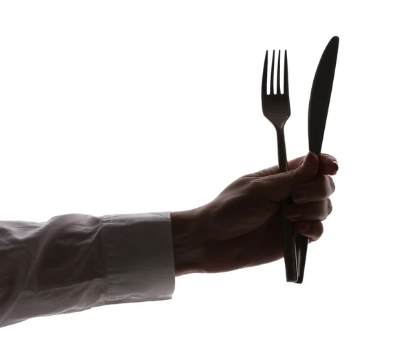 stock image Silhouette of woman's hands with fork and knife isolated on white