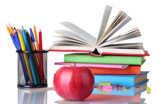 Sammansättningen av böcker, pappersvaror och ett äpple isolerad på vit — Stockfoto