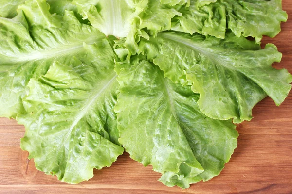 Lettuce on wooden background — Stock Photo, Image
