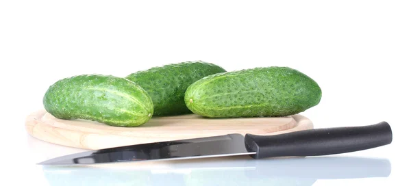 Cucumbers on a cutting board isolated on white — Stock Photo, Image