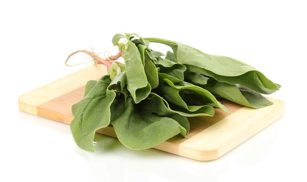 Fresh spinach on wooden board isolated on white — Stock Photo, Image