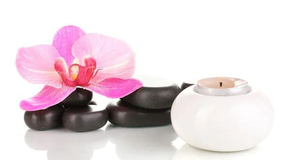 Spa stones with orchid flower and candle isolated on white — Stock Photo, Image