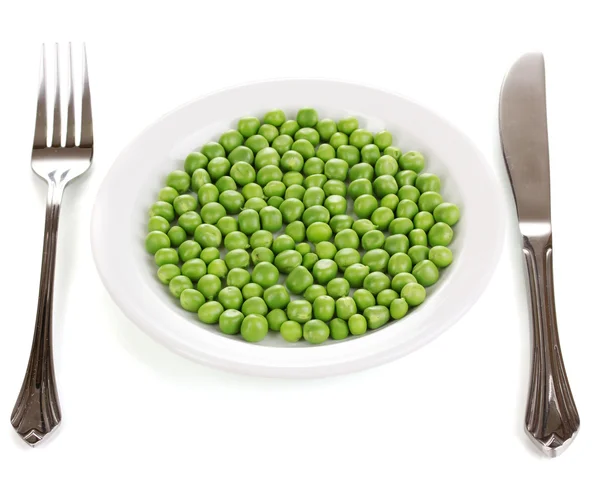 Green peas on plate isolated on white — Stock Photo, Image