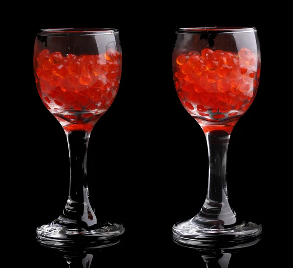 Red caviar in glasses isolated on black — Stock Photo, Image