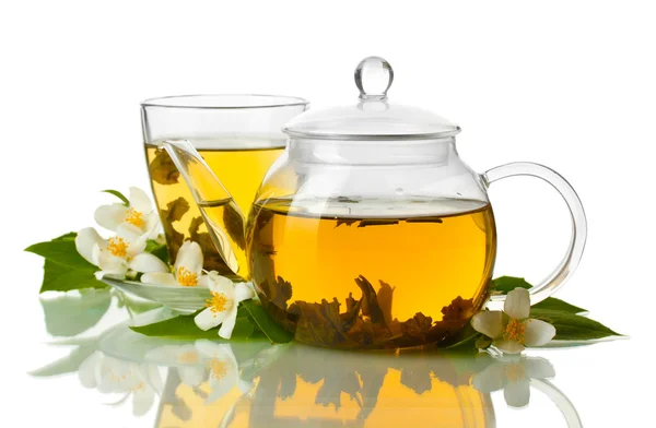 Green tea with jasmine in cup and teapot isolated on white Royalty Free Stock Images