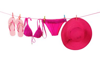 Women's swimsuit, hat and flip-flops hanging on a rope on white background clipart