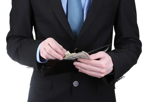 Homem de negócios tomando dinheiro na carteira isolado no branco — Fotografia de Stock