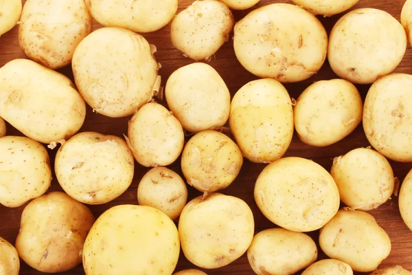 stock image Potatoes on the table background close-up