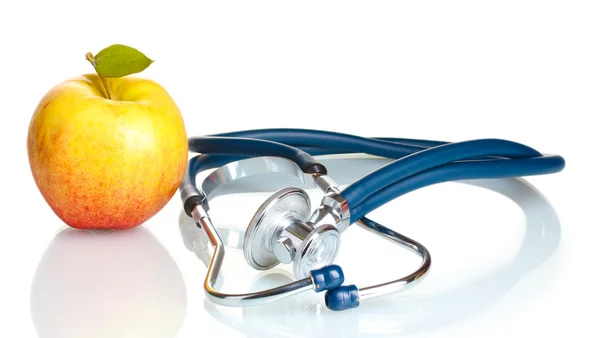 Medical stethoscope and apple isolated on white — Stock Photo, Image