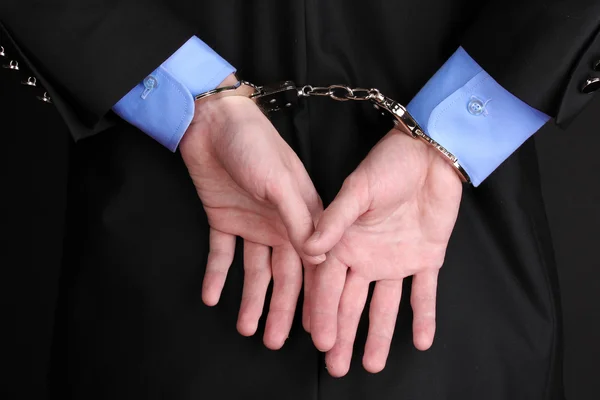 Businessman hands fettered with handcuffs — Stock Photo, Image