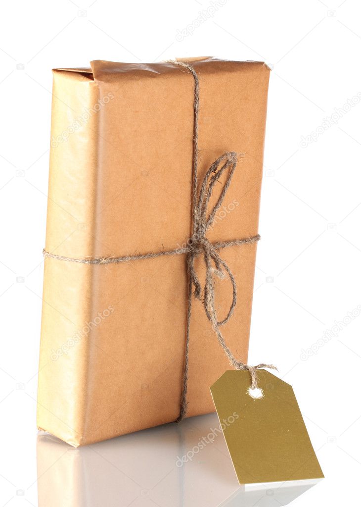 Parcel wrapped in brown paper tied with twine and with blank label isolated on white
