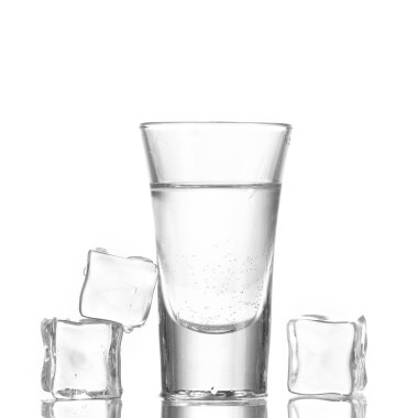 Glass of vodka with ice isolaled on white clipart