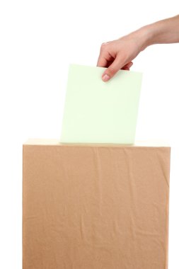 Hand with voting ballot and box isolated on white clipart