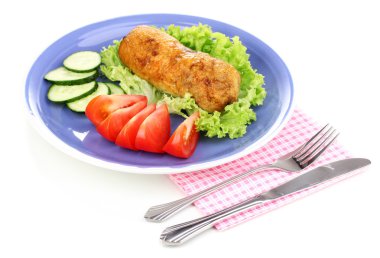 Tasty meat cutlet with garnish on plate isolated on white