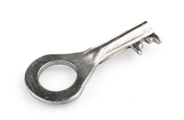 白で隔離される金属製のキー — ストック写真
