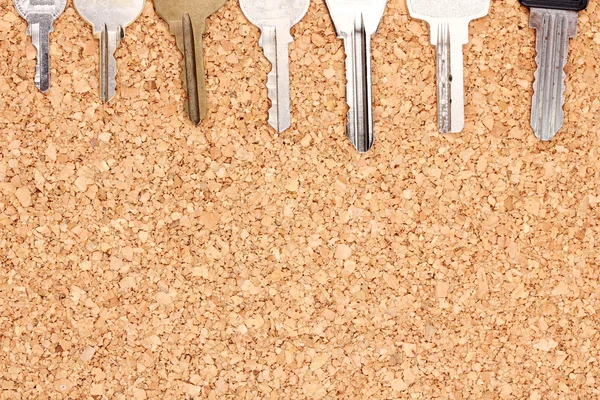 Keys on cork background — Stock Photo, Image