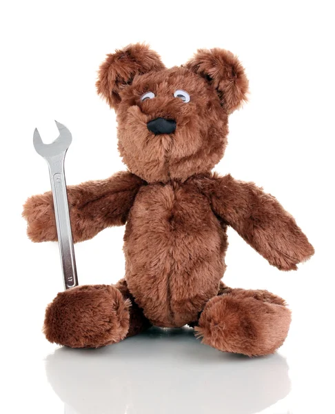 Zittend bear speelgoed met moersleutel geïsoleerd op wit — Stockfoto