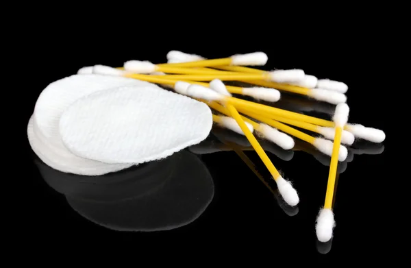 Cotton swabs and sticks isolated on black — Stock Photo, Image