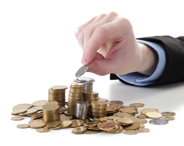 Empresário mão colocar moedas isoladas em branco — Fotografia de Stock