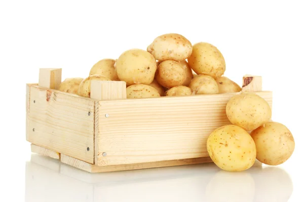 Young potatoes in a wooden box isolated on white close-up — Stock Photo, Image