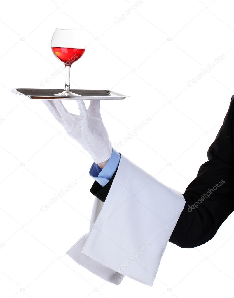 Formal waiter with a glass of wine on silver tray isolated on white