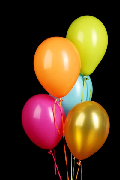 Colorful balloons on black background close-up — Stock Photo, Image