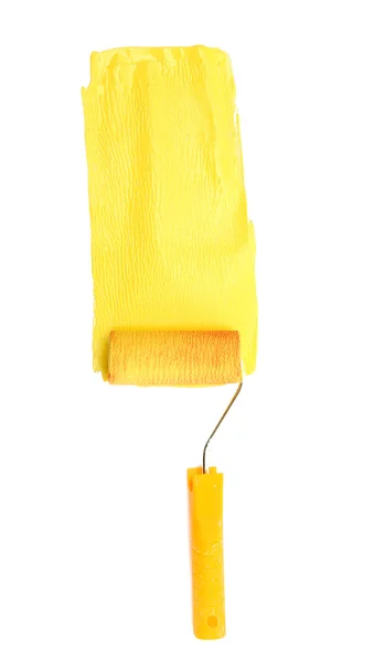 Rolo de pintura com tinta amarela isolada em branco — Fotografia de Stock