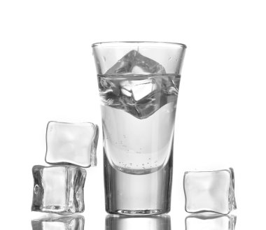 Glass of vodka with ice isolaled on white clipart