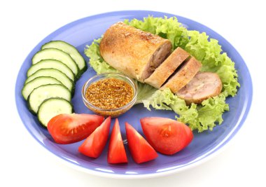 Tasty meat cutlet with garnish on plate isolated on white