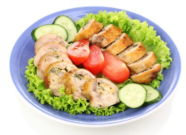 Tasty meat cutlet with garnish on plate isolated on white