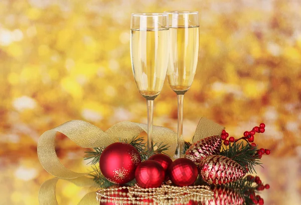 Two glasses with christmas decoration on yellow — Stock Photo, Image