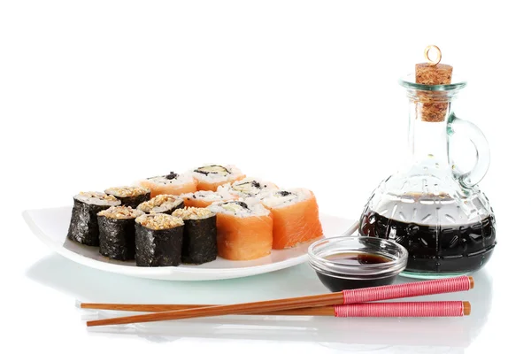 Tasty rolls served on white plate with chopsticks and soy sauce isolated on white — Stock Photo, Image