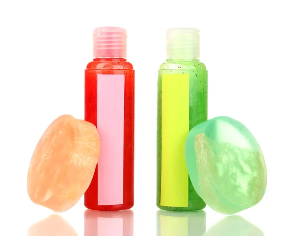 Bottles with scrub and soaps isolated on white — Stock Photo, Image