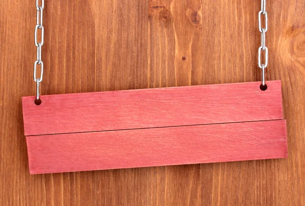 Placa de madeira do sinal da cor no fundo de madeira — Fotografia de Stock