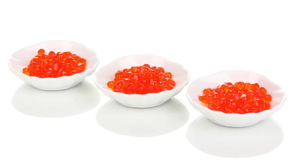 Caviar rojo en cuencos blancos aislados en blanco —  Fotos de Stock