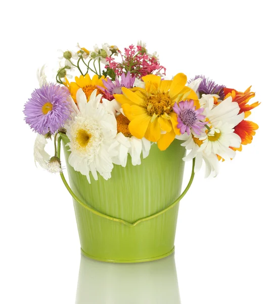 Beautiful bouquet of bright wildflowers in green metal bucket, isolated on white — Stock Photo, Image
