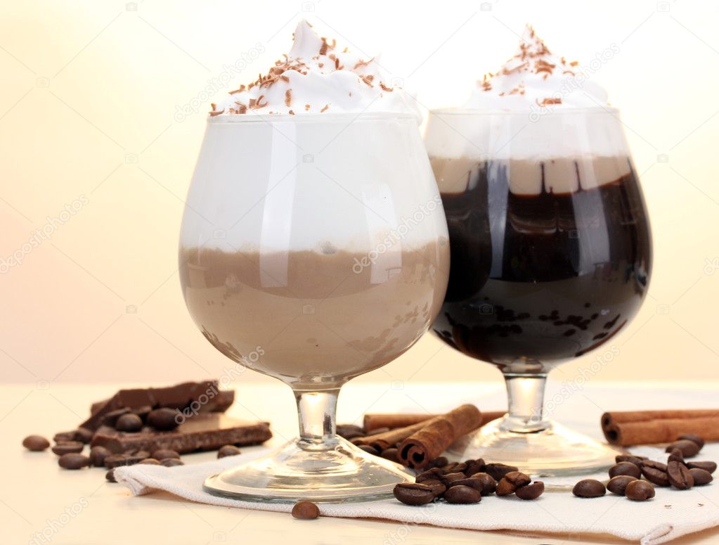 Glasses of coffee cocktail on wooden table