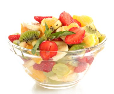 Glass bowl with fresh fruits salad isolated on white clipart