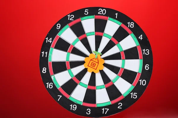 Darts with stickers depicting the life values on colorful background. The darts hit the target — Stock Photo, Image