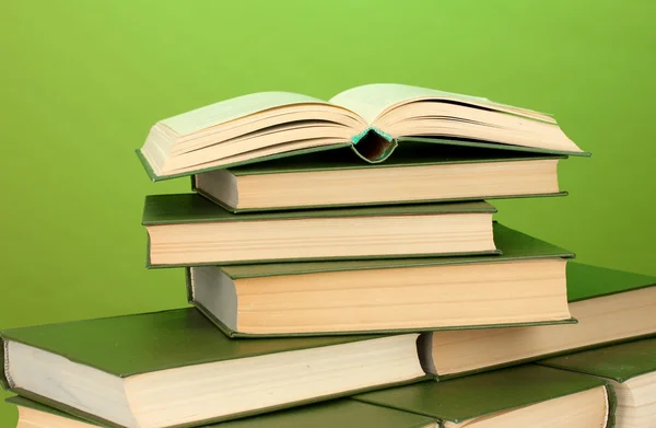 Pile of books on green background close-up — Stock Photo, Image