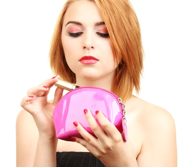 Mooie jonge vrouw met mascara in cosmetica zak — Stockfoto