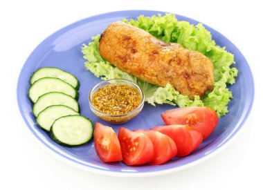 Tasty meat cutlet with garnish on plate isolated on white