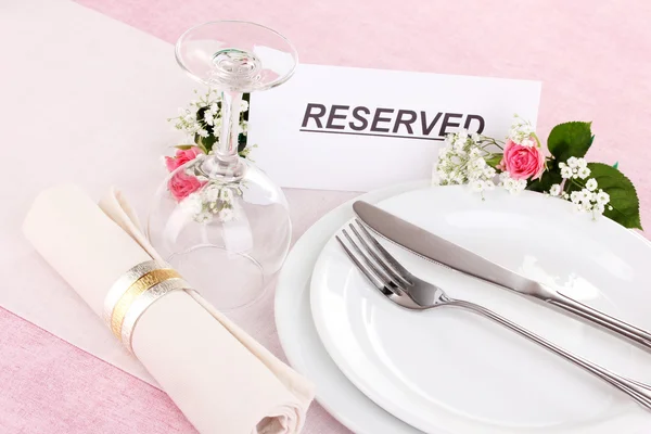 Table setting with reserved card in restaurant — Stock Photo, Image