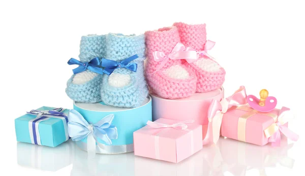 Baby boots, pacifier, gifts and blank postcard isolated on white — Stock Photo, Image