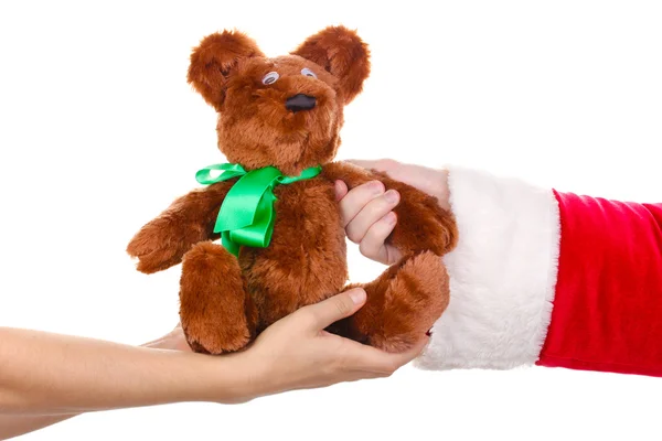 Père Noël main tenant jouet ours isolé sur blanc — Photo