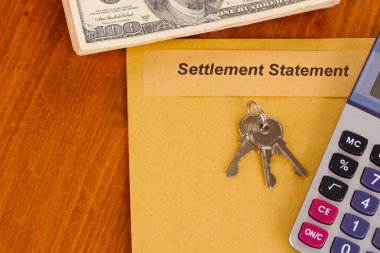 Folder with the settlement statement on wooden background close-up clipart