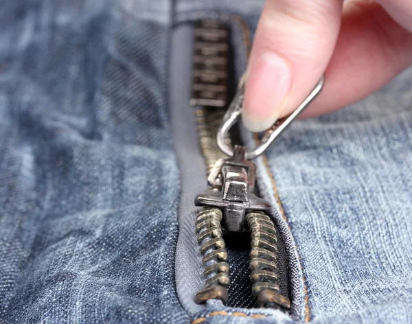 Zipper on dark jeans closeup — Stok fotoğraf